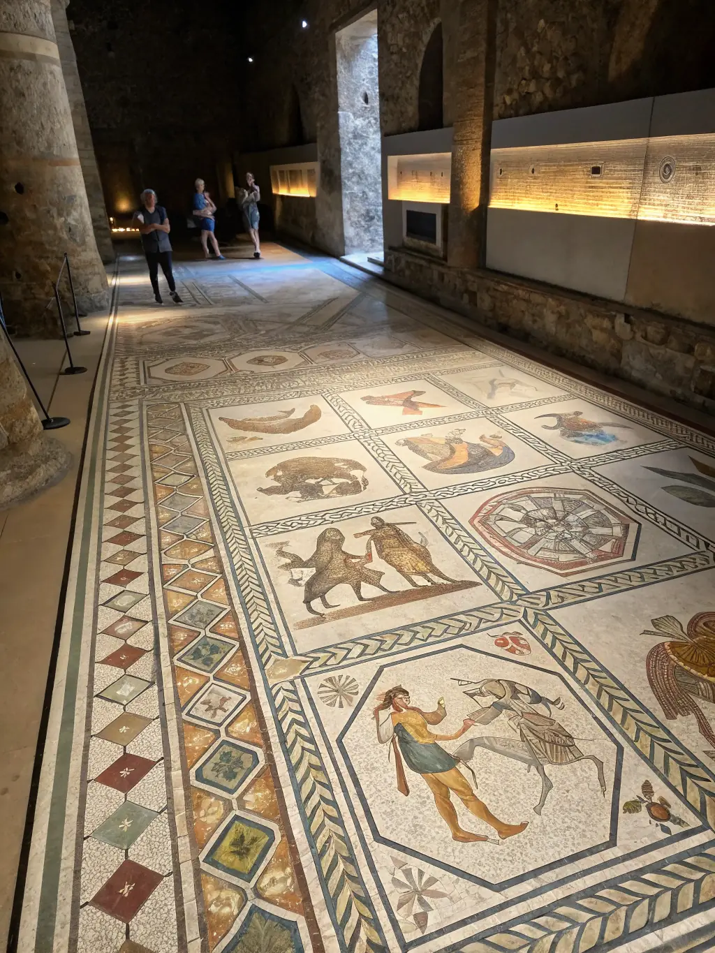A high-resolution image showcasing a newly discovered Roman mosaic floor, partially excavated, with vibrant colors and intricate geometric patterns.